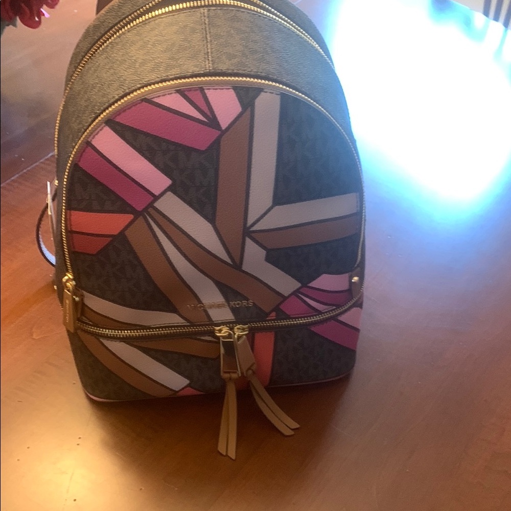 Michael Kors Pink and Brown Backpack Chic and Functional brand new.